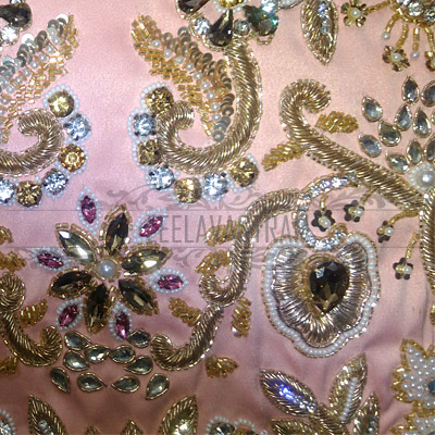 Crystal and bead embroidery on blush fabric